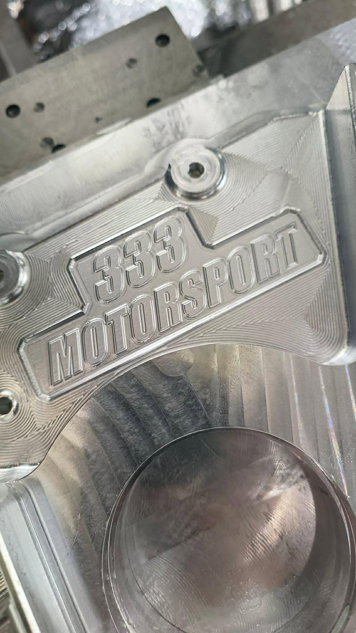 333 MOTORSPORT logo engraved on a billet part